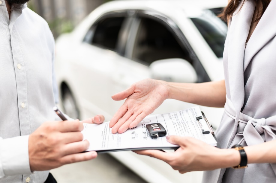 A customer picking up the keys to their rental car