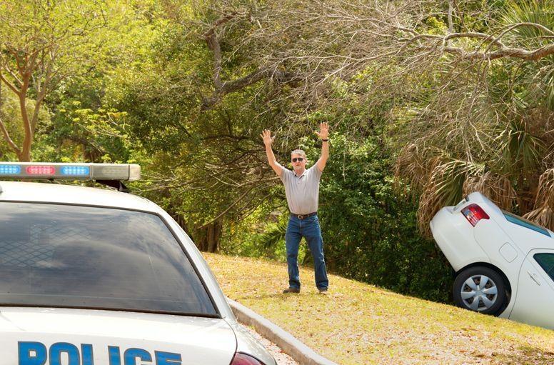 Hire car in a ditch with police there to help