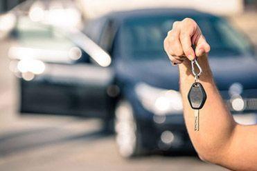 person holding car keys