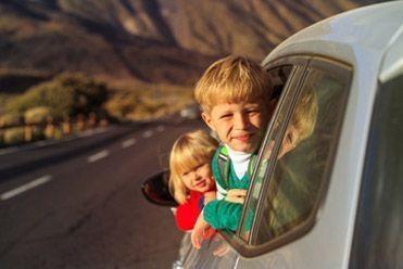 Children enjoying a car journey