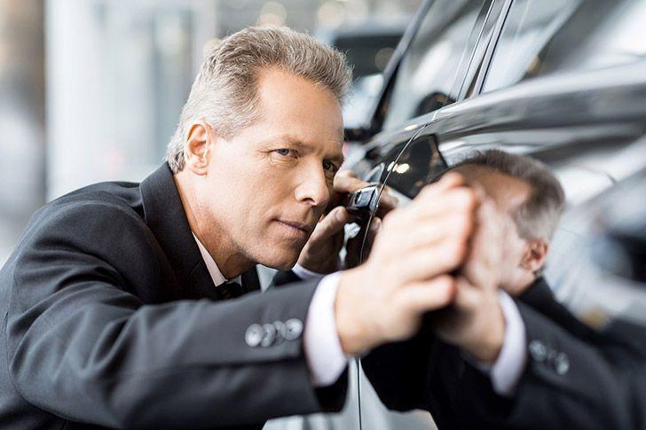 Customer inspecting rental car