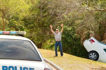 Hire car in a ditch with police there to help