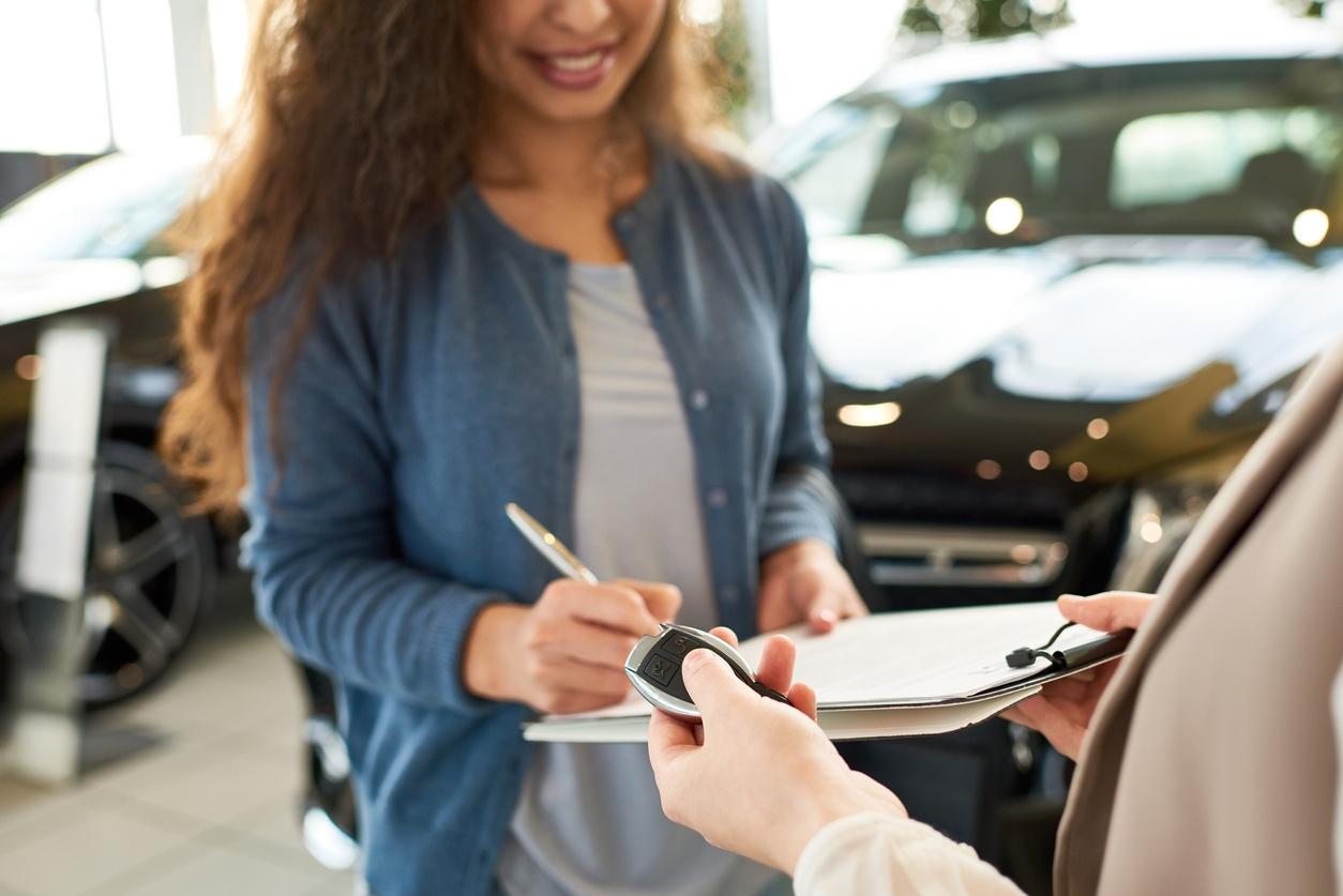 Signing car rental contract