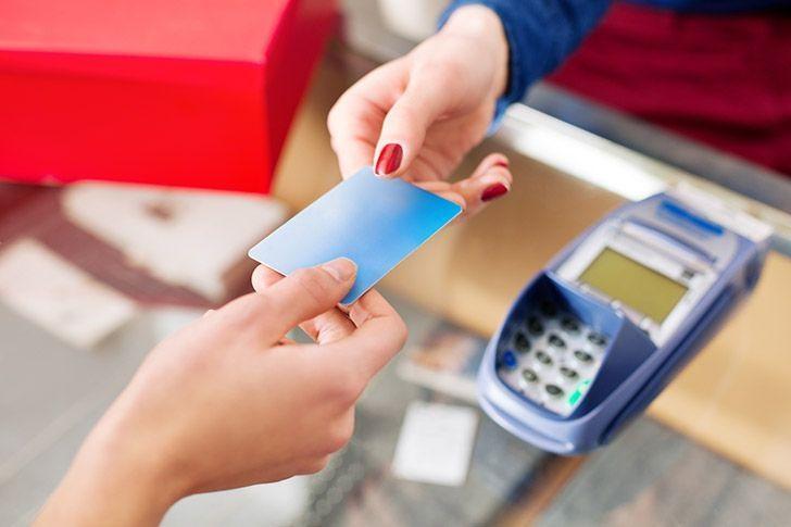 Woman paying with credit card 