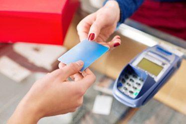 Woman paying with credit card 