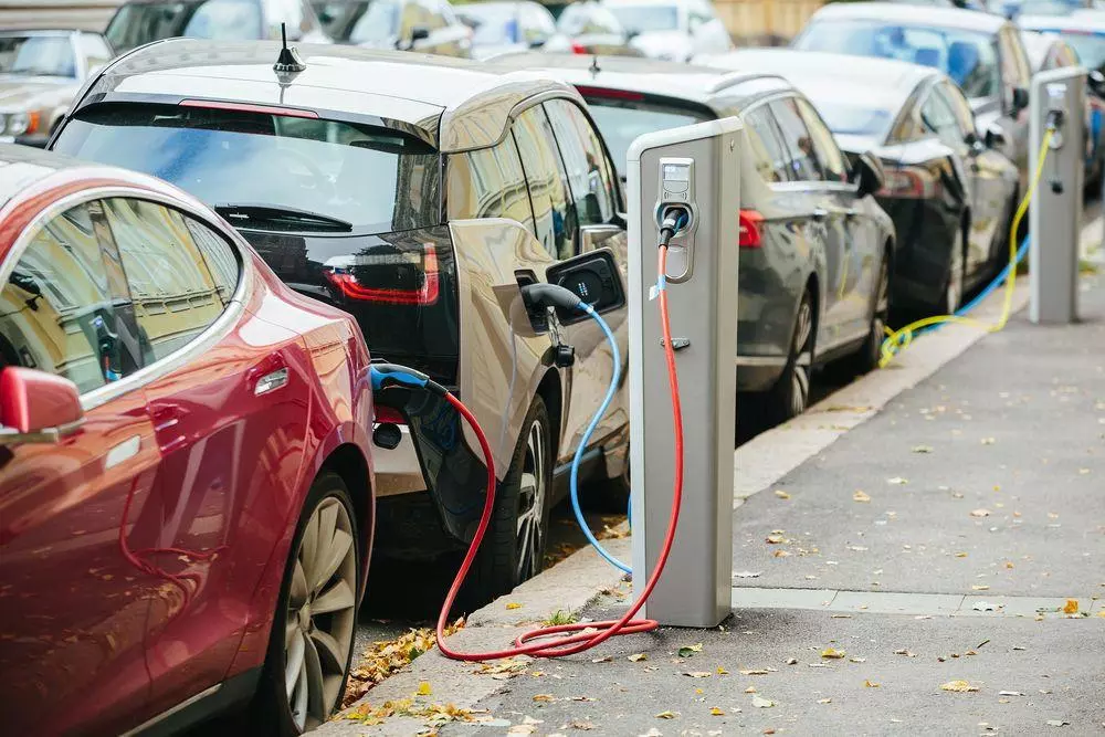 Electric cars recharging on a street