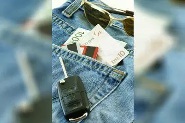 Rental car key and Euros in jeans pocket.