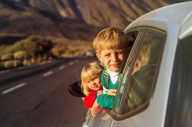 Children enjoying a car journey