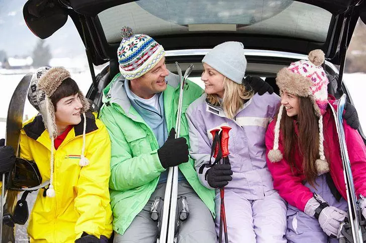 Family with rental car on ski holiday
