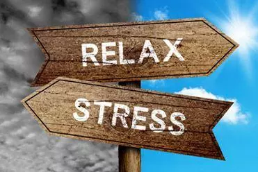 Road sign pointing to relax and stress 
