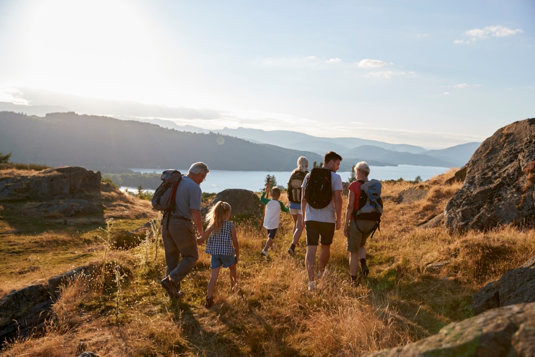 Family hiking through countryside